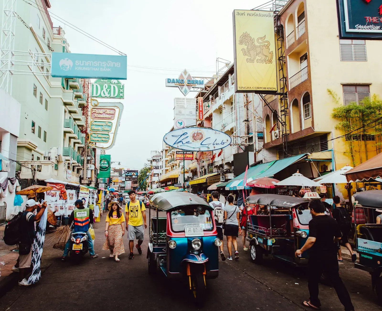 People on a Bangkok street among high-rises