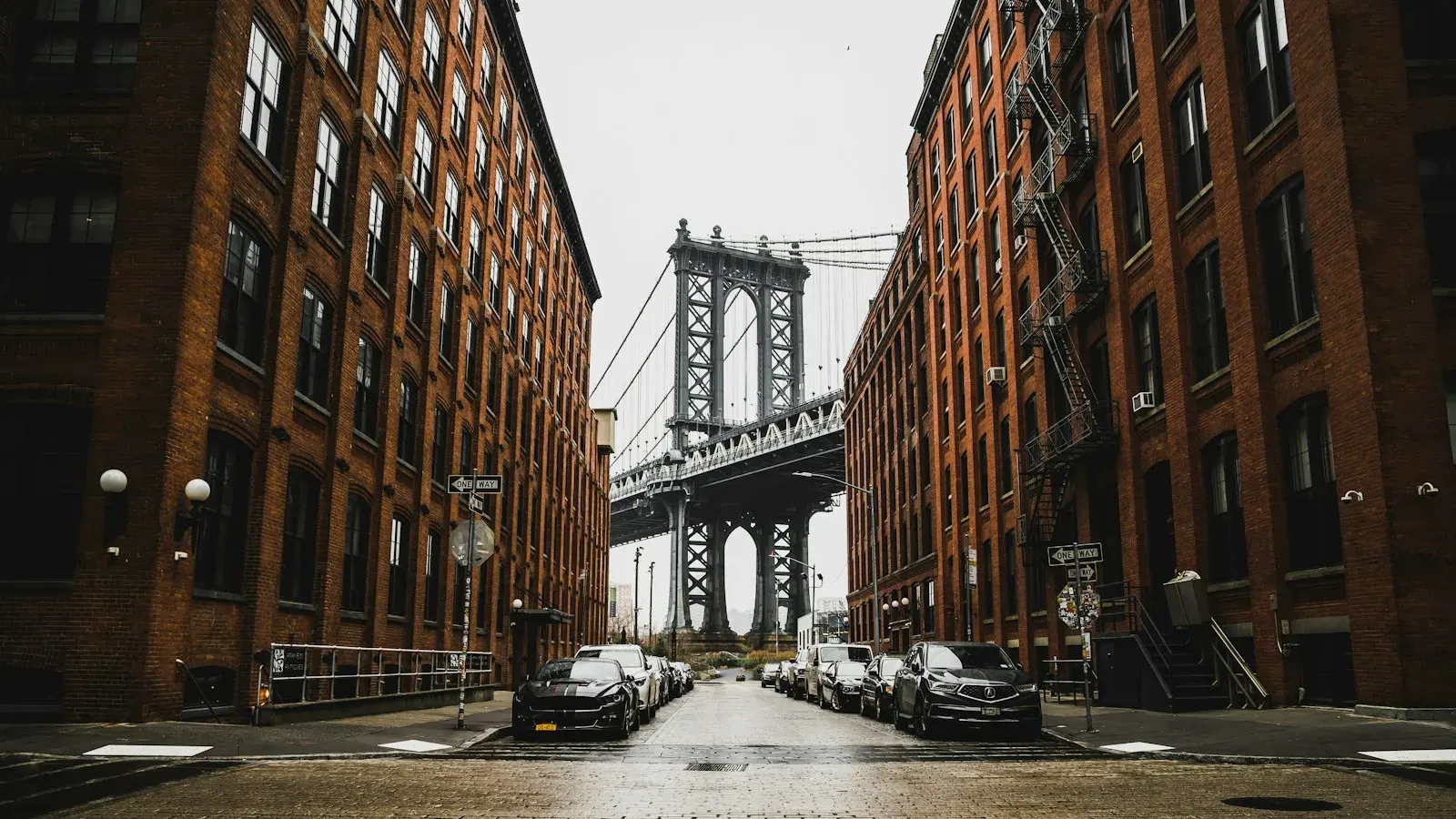 Manhattan Bridge framed by brick buildings